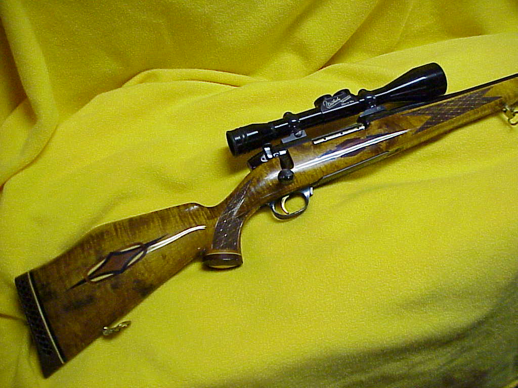 Weatherby .340 W Mag. Custom Deluxe Mk V with 2 3/4x to 10x Weatherby Scope.